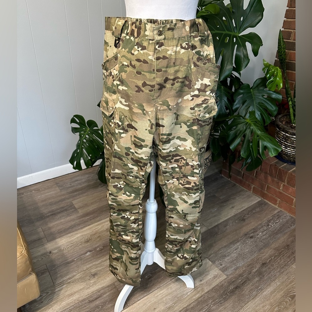 #6)  women Lightweight camouflage pants with lots of pockets.  never worn.
